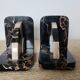 Art Deco pair of bookends in Portor marble and onyx, 1930s-1950s.