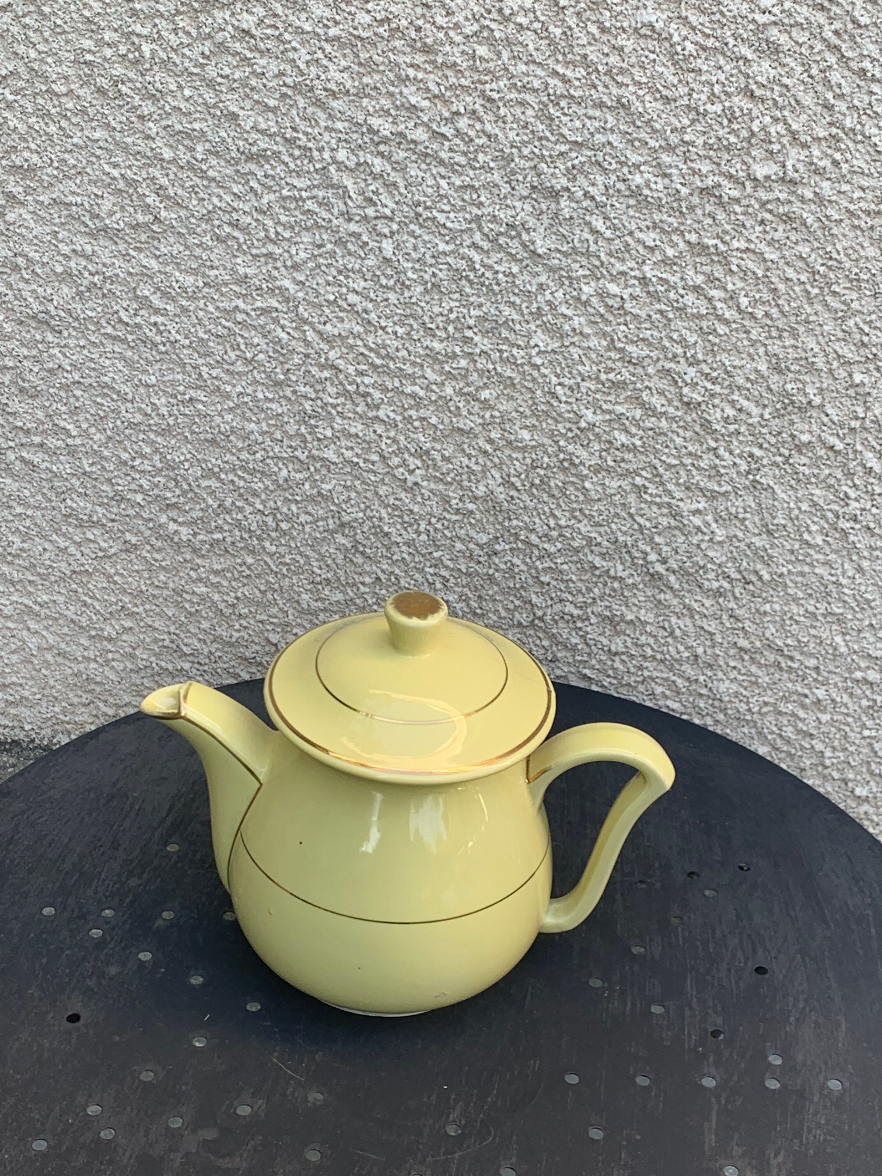 Teapot, yellow earthenware coffee maker and vintage gold edging