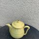 Teapot, yellow earthenware coffee maker and vintage gold edging