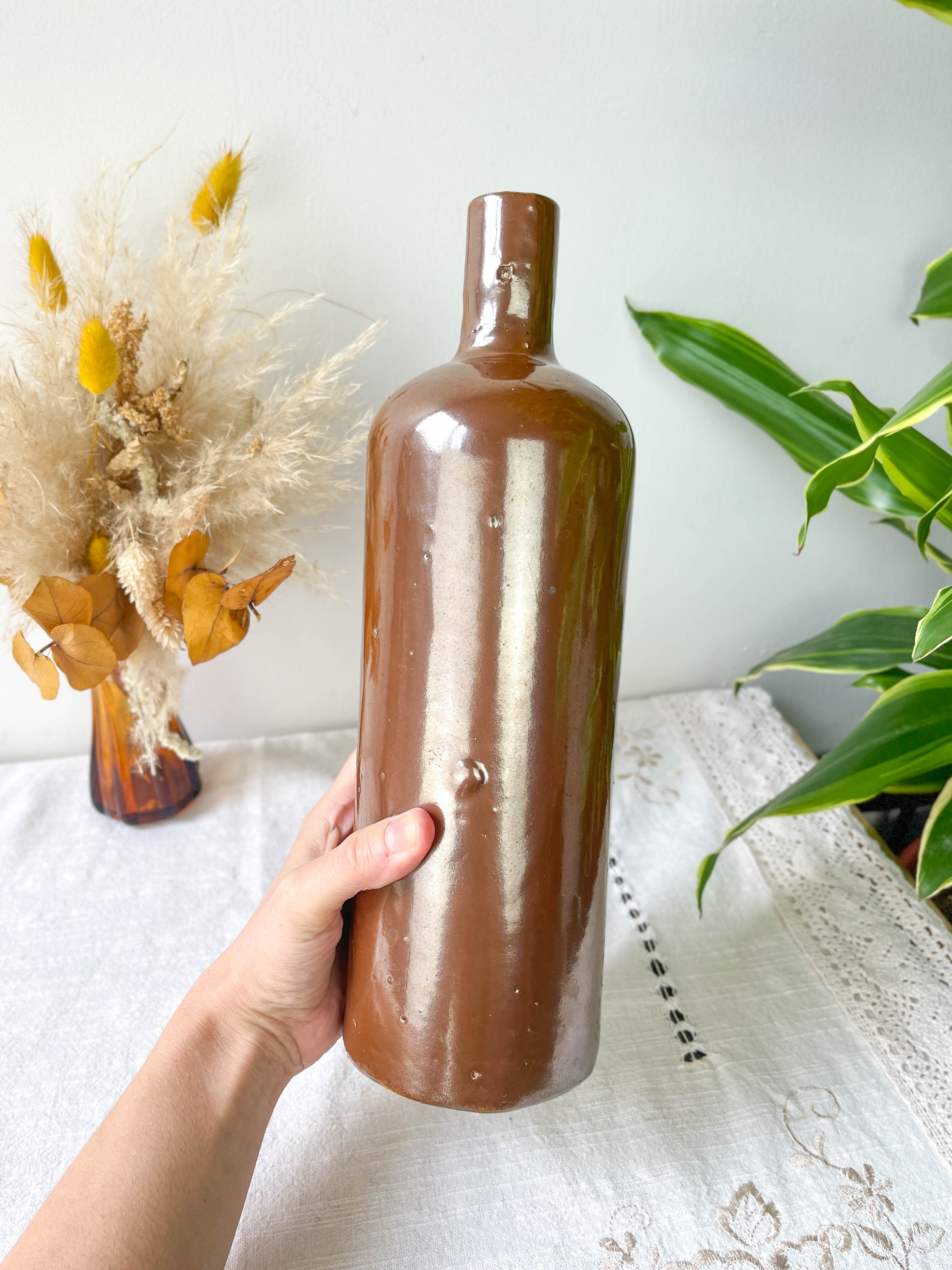 Vintage iridescent brown stoneware bottle