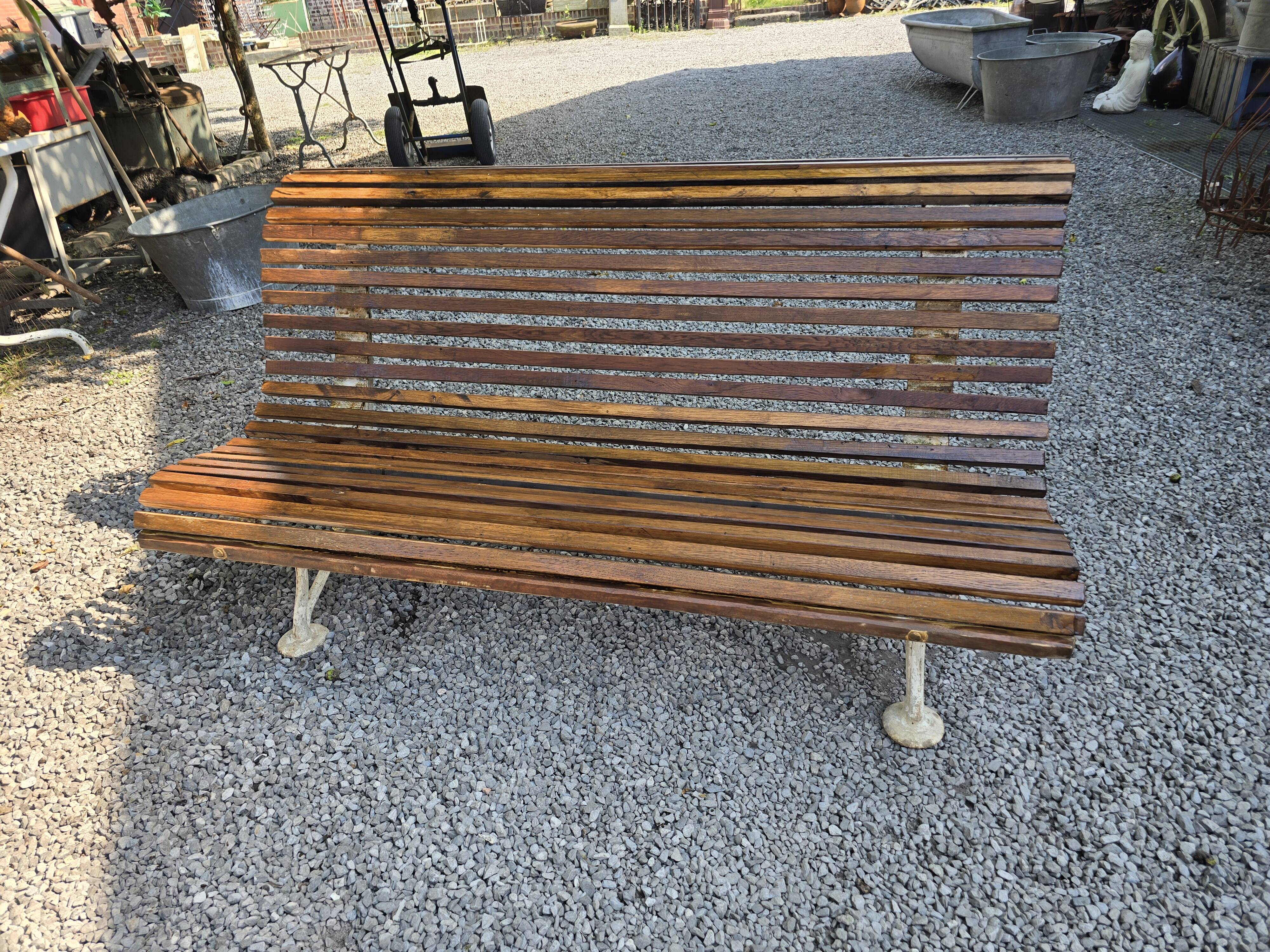 Garden bench with cast iron legs and oak slats