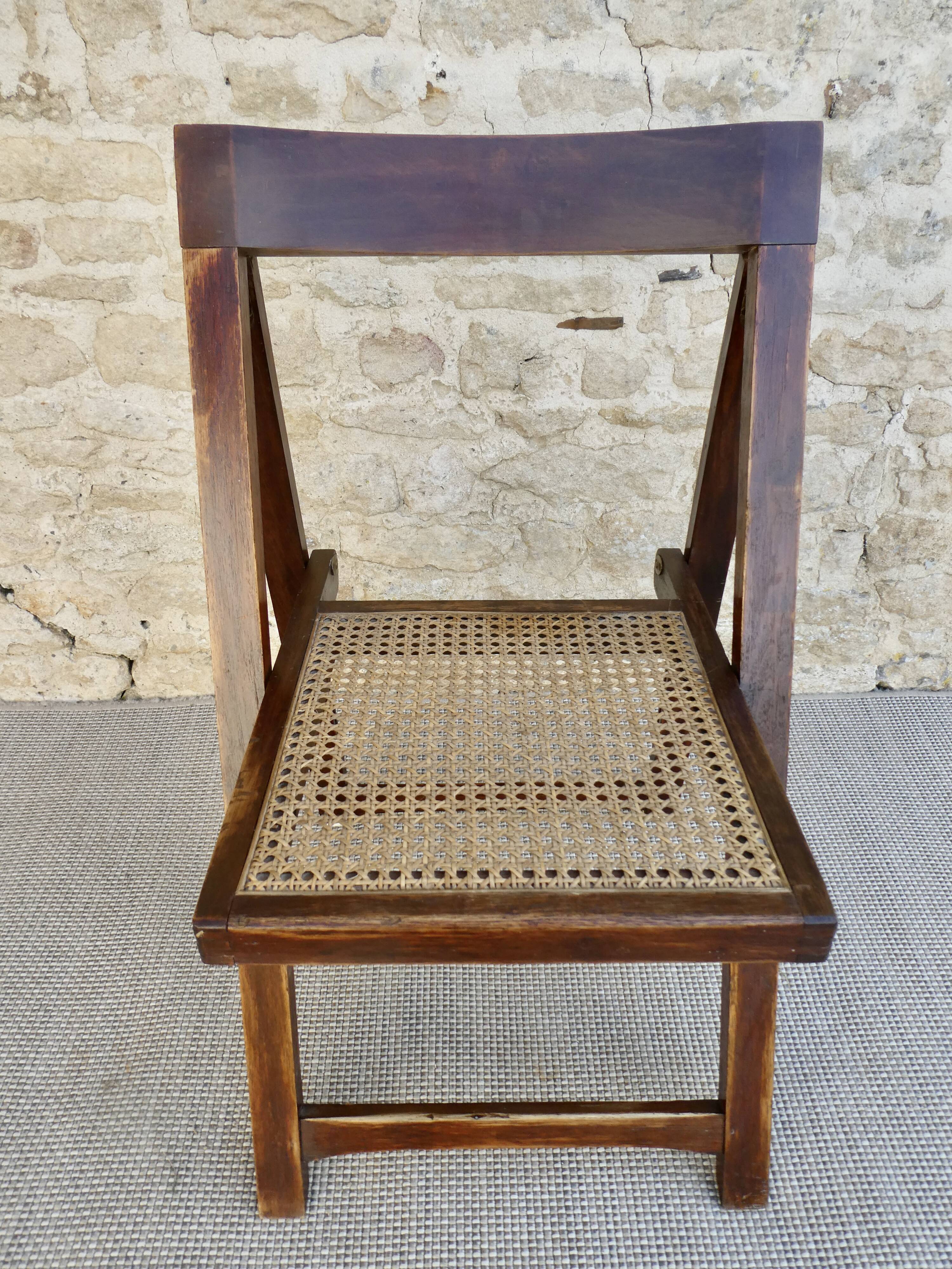 Wooden folding chair with caned seat