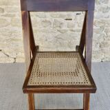 Wooden folding chair with caned seat