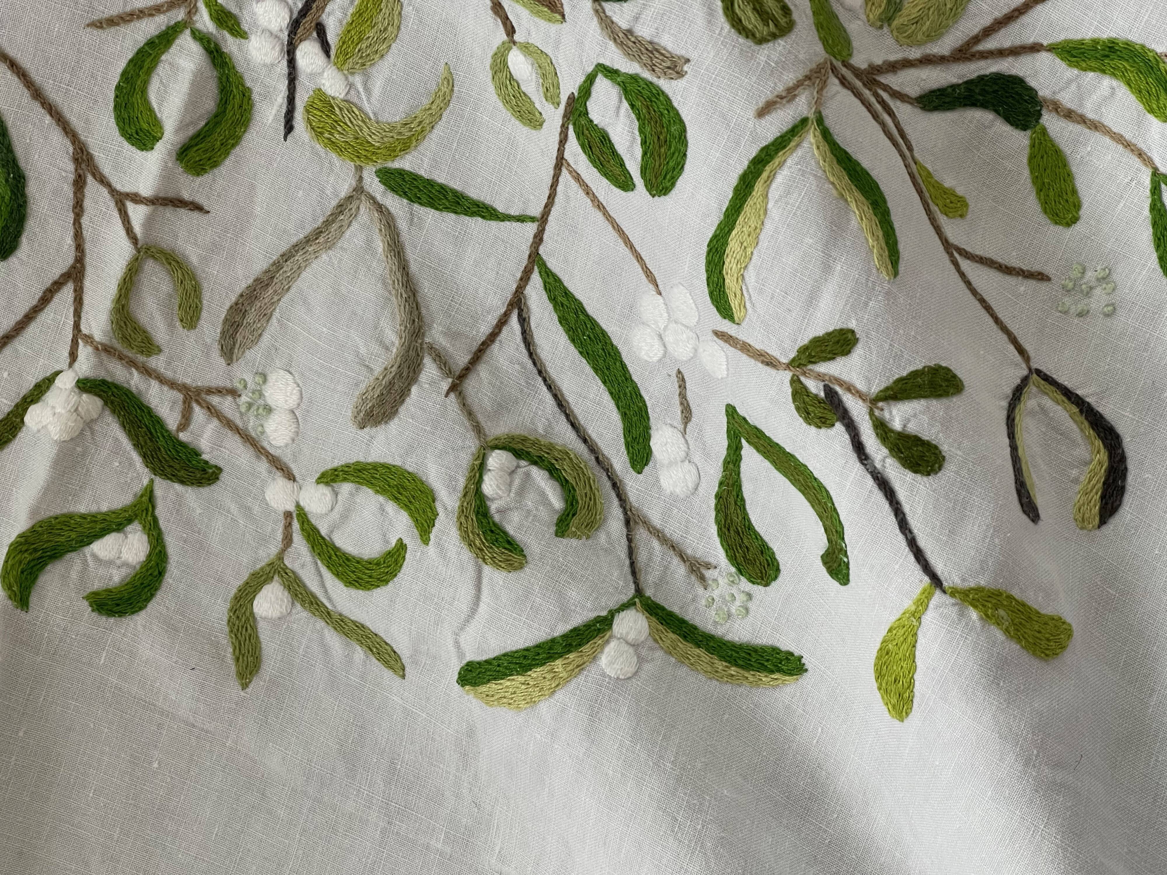 Hand-embroidered tablecloth on rectangular thread canvas
