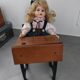 Wooden swing desk and porcelain dolls
