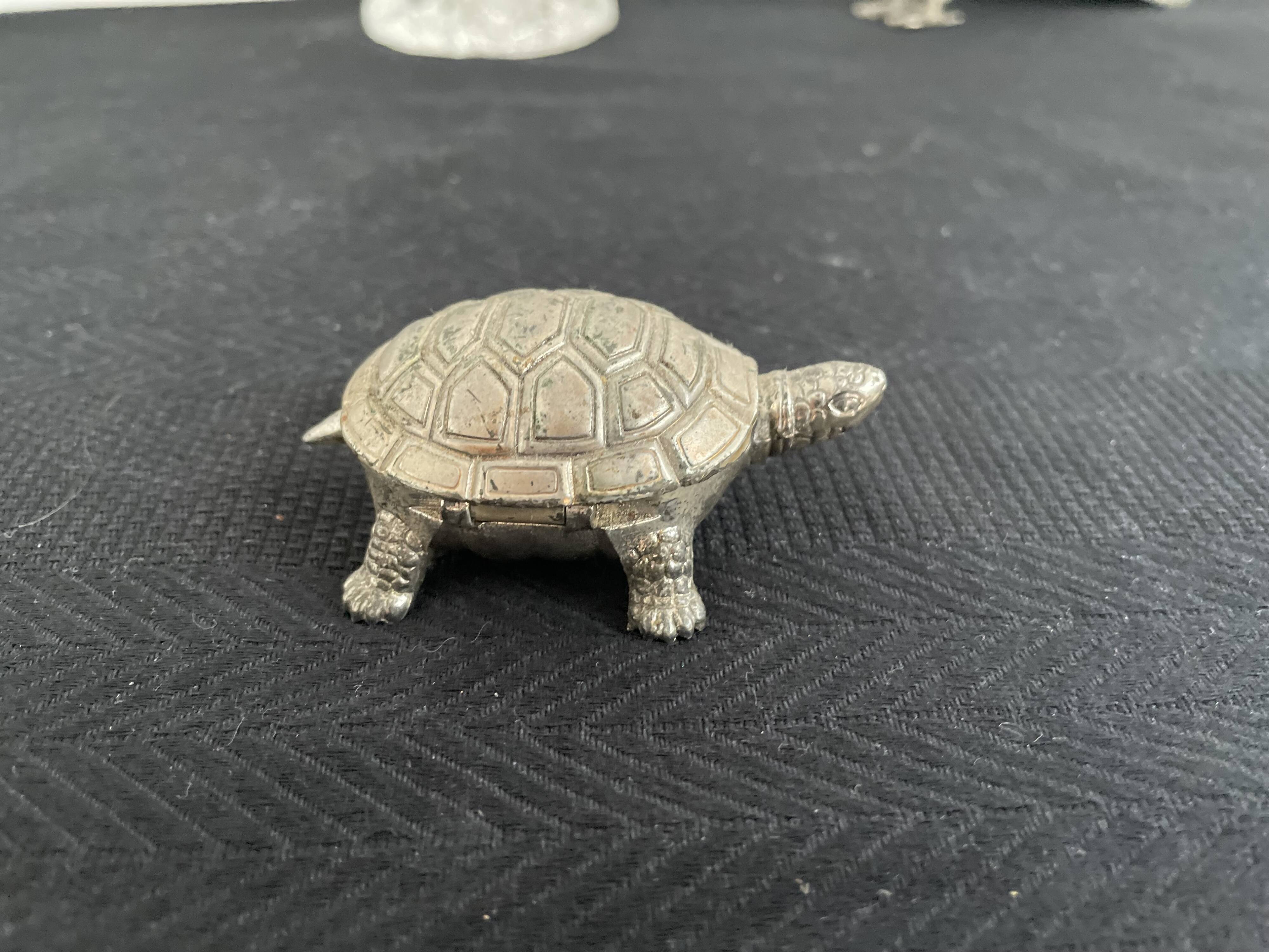Ancient tortoise in silver metal