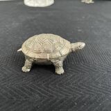 Ancient tortoise in silver metal