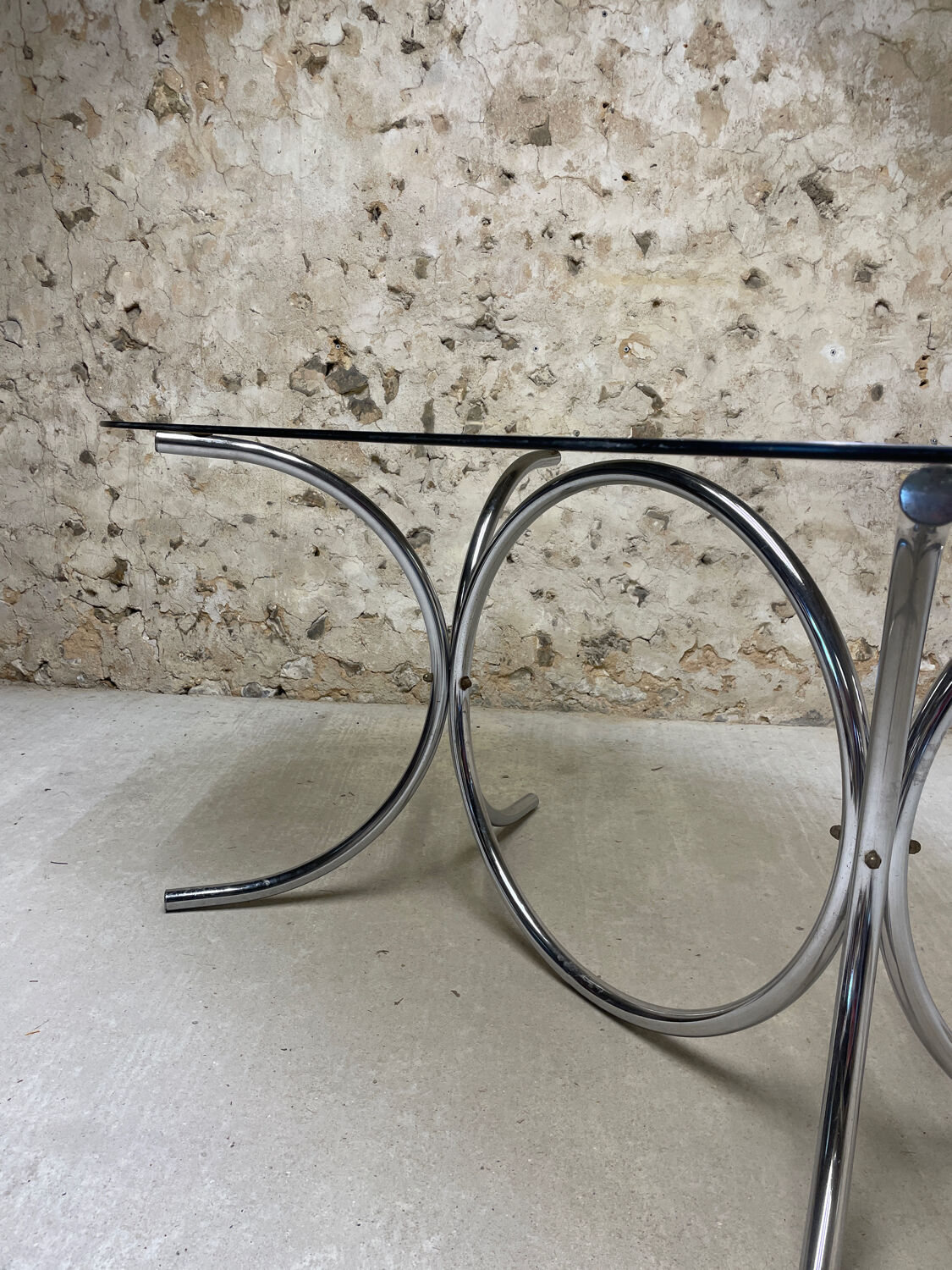 Smoked glass oval table from the 1970s.