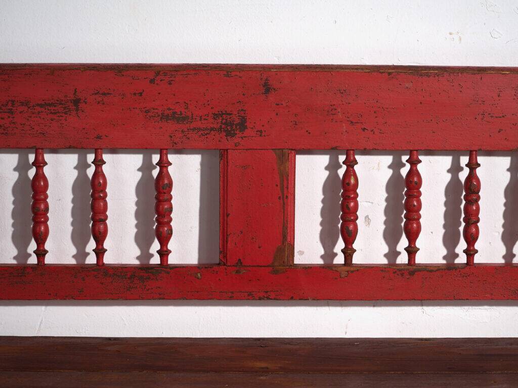 Old red-painted pine bench with turned backrest – Central Europe, circa 1900