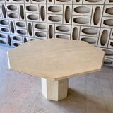 Light-colored octagonal travertine dining table
