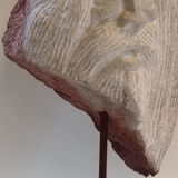 Carved stone head sculpture