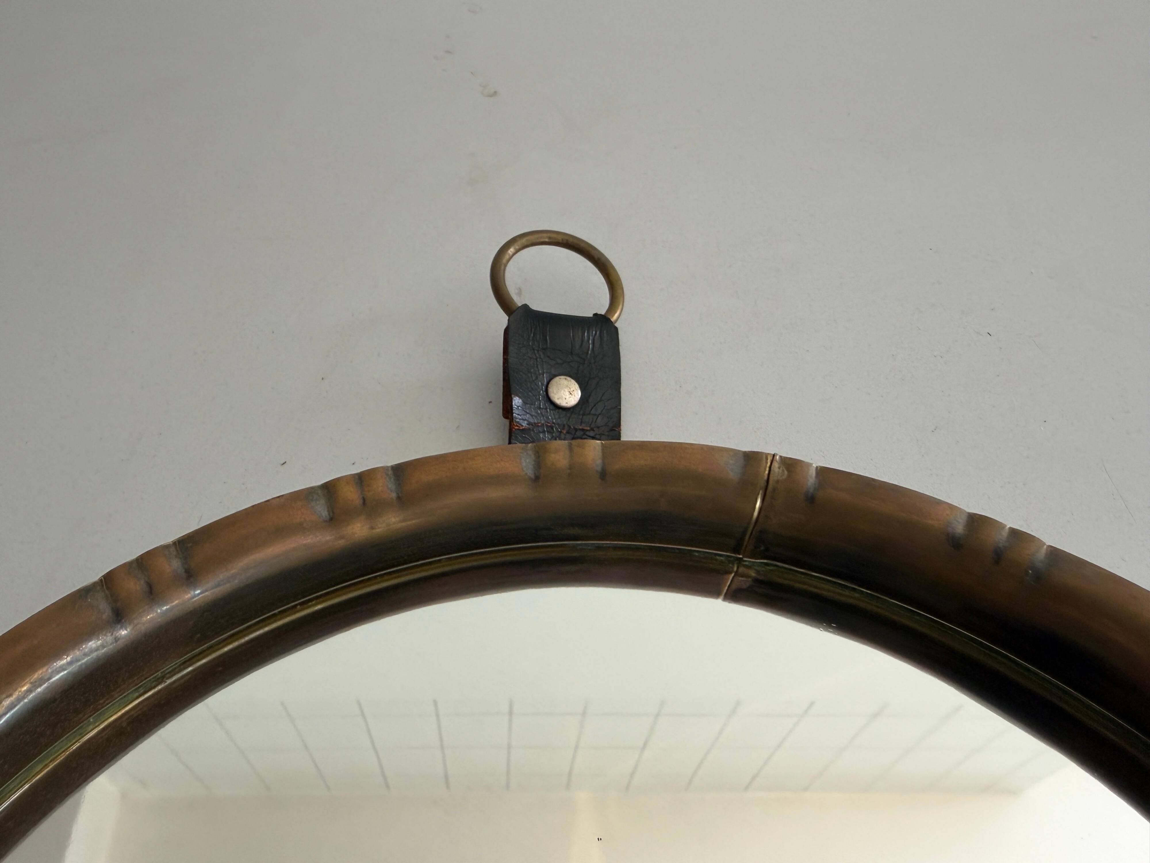 Round wall mirror with brass frame and leather hanger, 1960, Germany