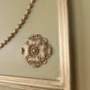 Louis XVI-style trumeau mirror with urn and dolphins – painted and gilded