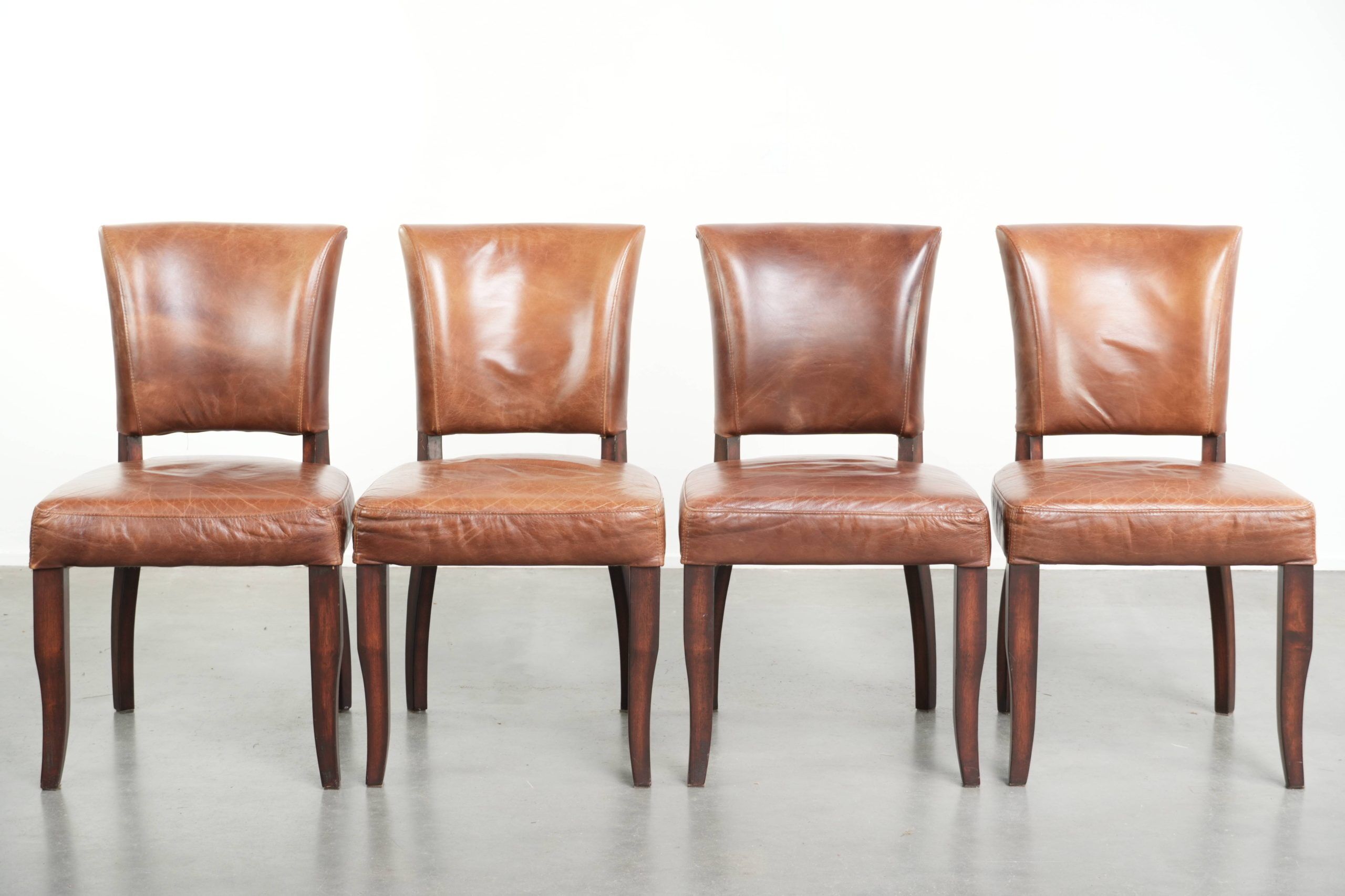 Set of 4 cognac-coloured cowleather dining chairs with decorative nails