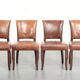 Set of 4 cognac-coloured cowleather dining chairs with decorative nails