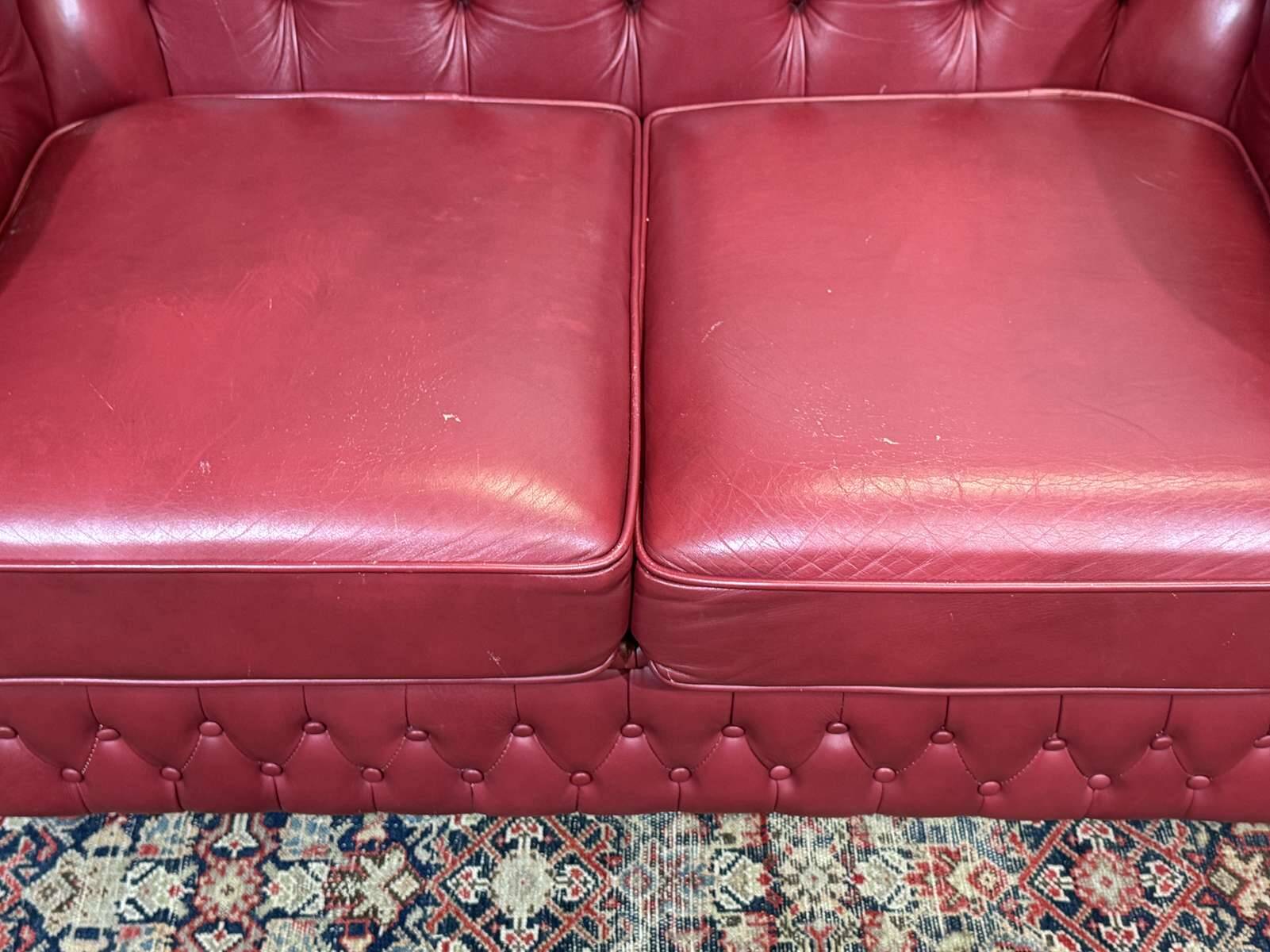 Chesterfield 2-seater leather sofa, modern production from the 2000s.