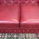 Chesterfield 2-seater leather sofa, modern production from the 2000s.