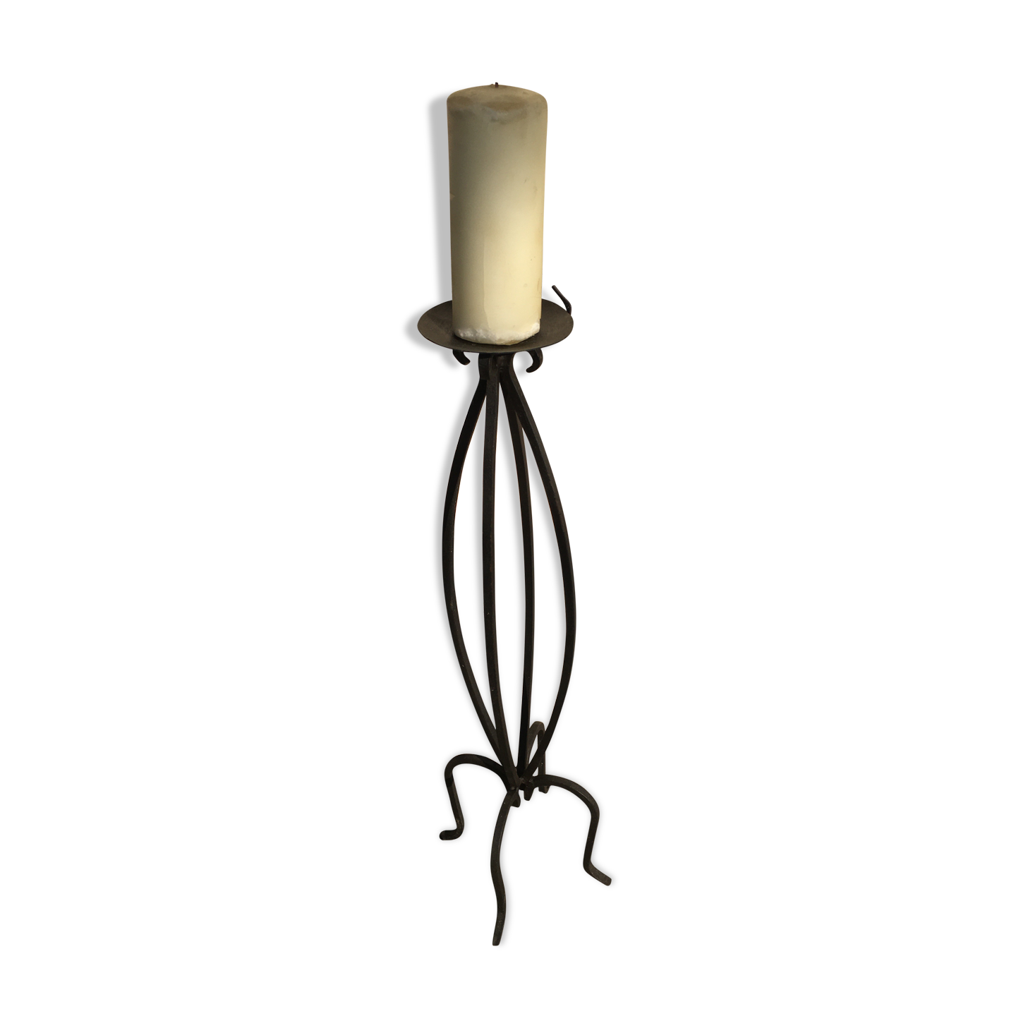 Wrought iron candlestick on feet