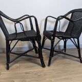 Paire de fauteuils noirs en rotin