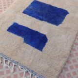 White Moroccan rug with abstract Klein blue patterns