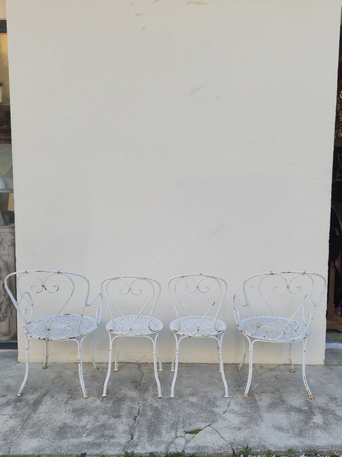 Garden furniture, two armchairs and two wrought iron chairs, period 1