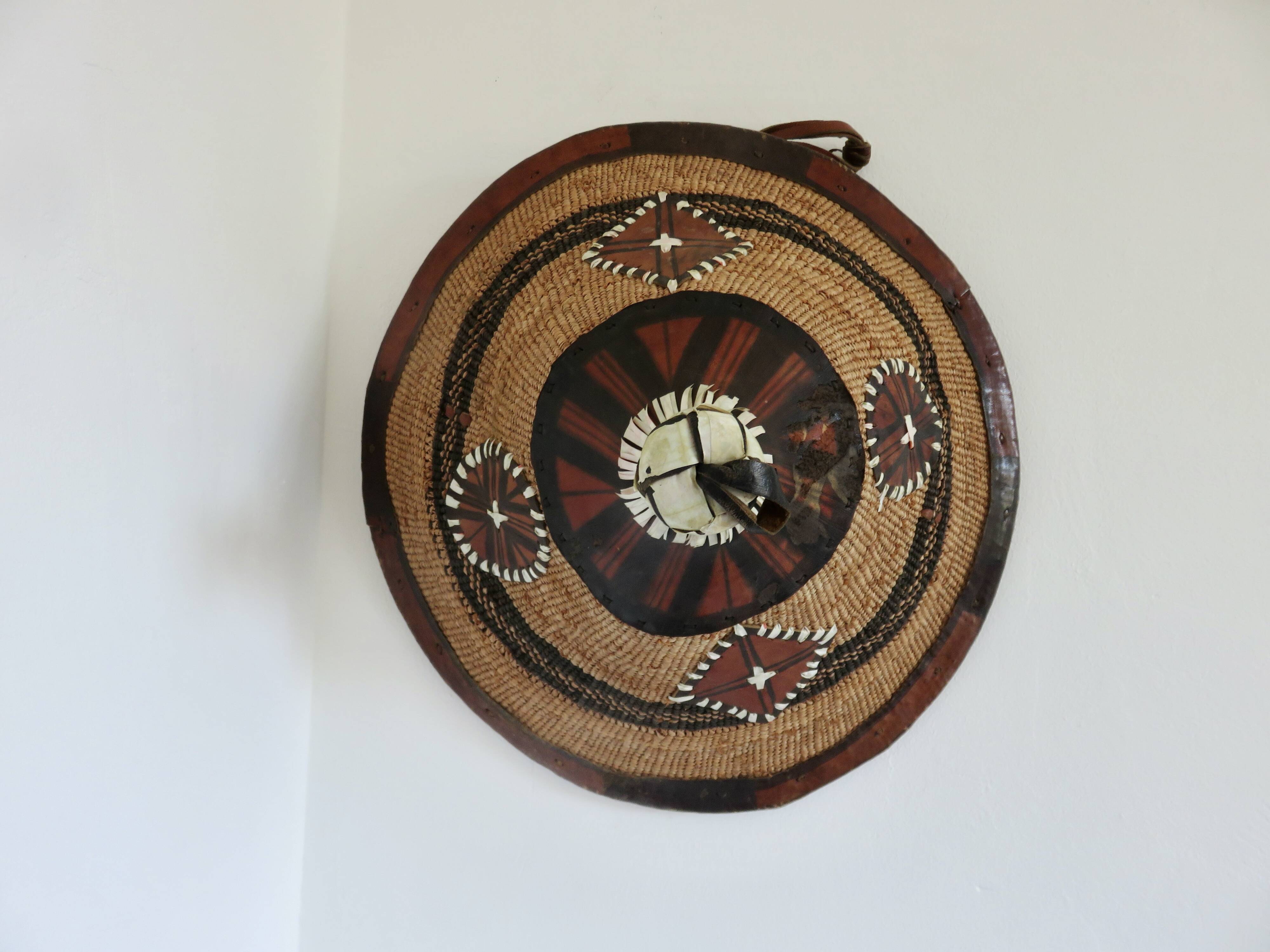 African conical hat, Fulani, in leather and braided rope, 1900, wall decoration