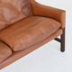 Canapé scandinave trois places en palissandre et cuir marron Danemark 1960