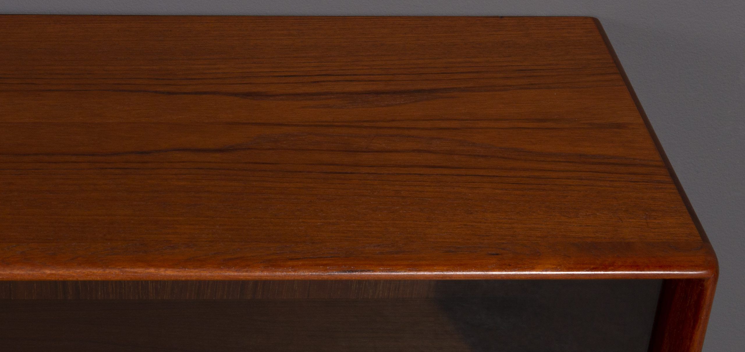 Teak wall cabinet with sliding glass doors