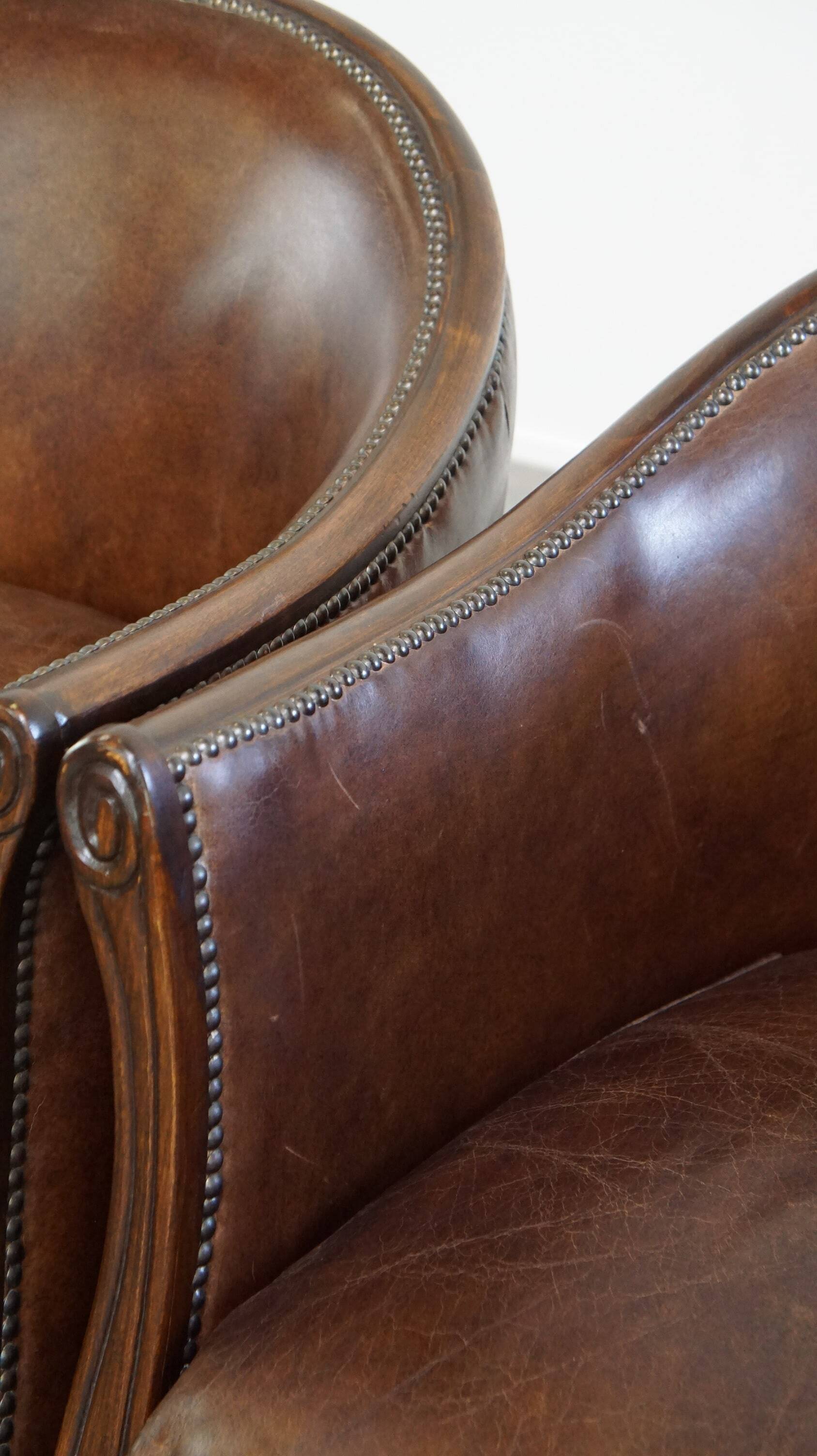 Set of 2 club chairs/armchairs in dark cognac leather