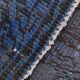 Vintage blue and black Turkish rug with traditional design, 163 × 268 cm