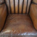 Sheep leather armchair finished with decorative nails