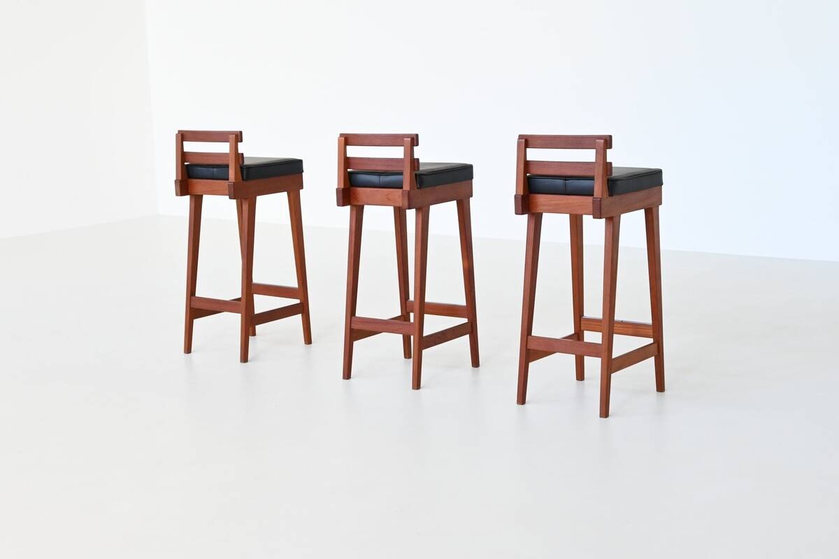 Erik Buck set of three bar stools in teak and leather Dyrlund Denmark 1960