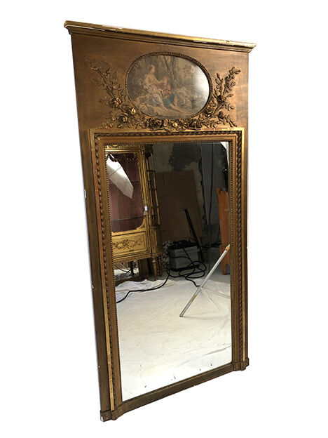 Louis XVI style trumeau in wood and gilded stucco and medallion engraving in the upper part