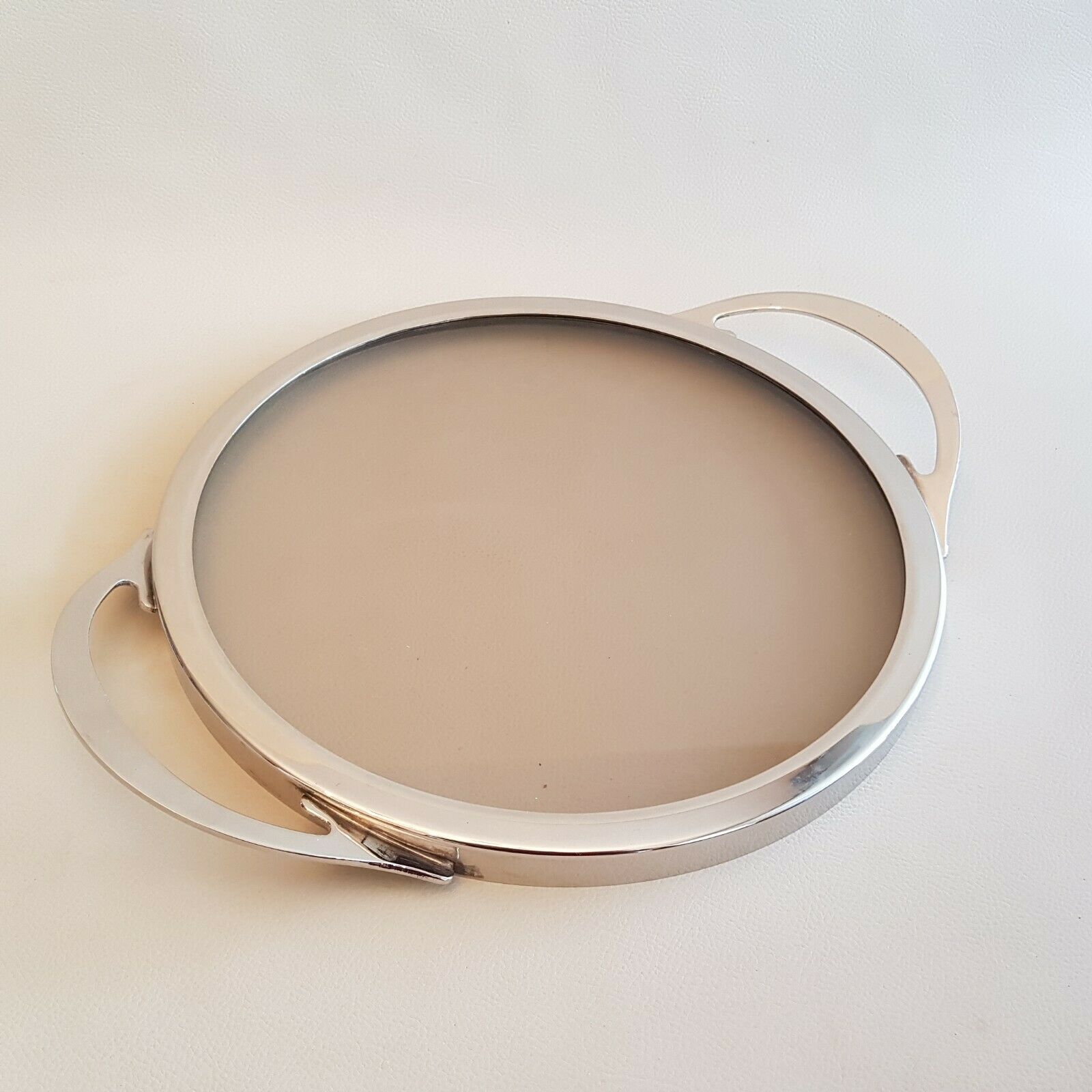 Round glass and art deco silver metal tray