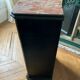 Chest of drawers with a red marble top.