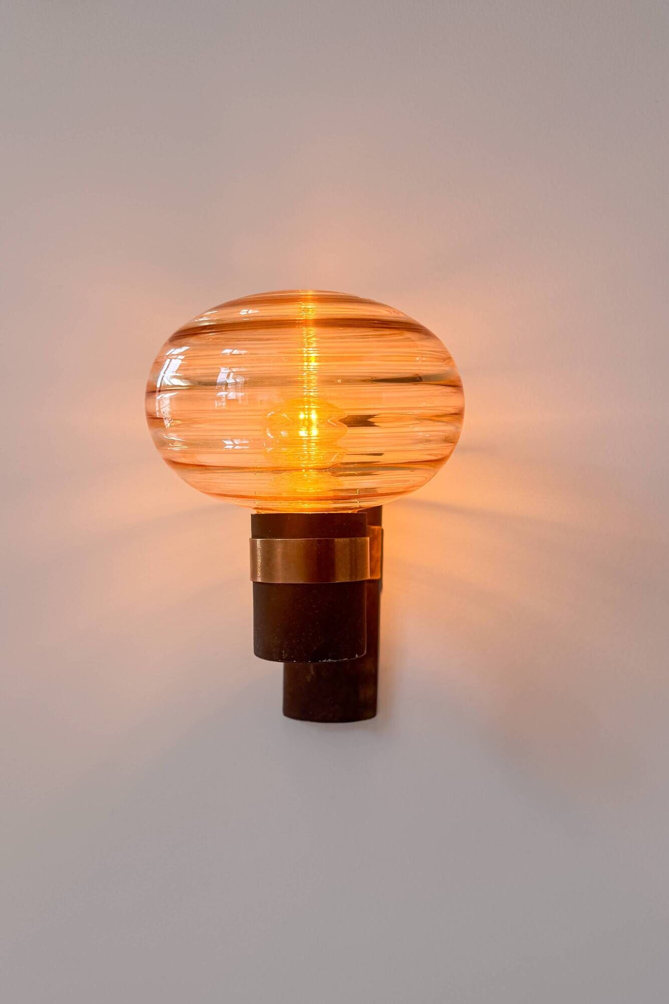 Pair of vintage wall lights, brass and amber glass, France, 1970.