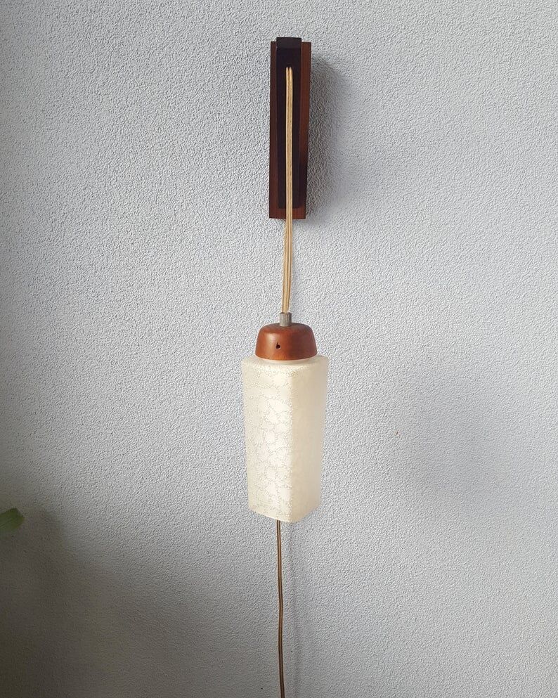 Wooden applique with 60s glass blind
