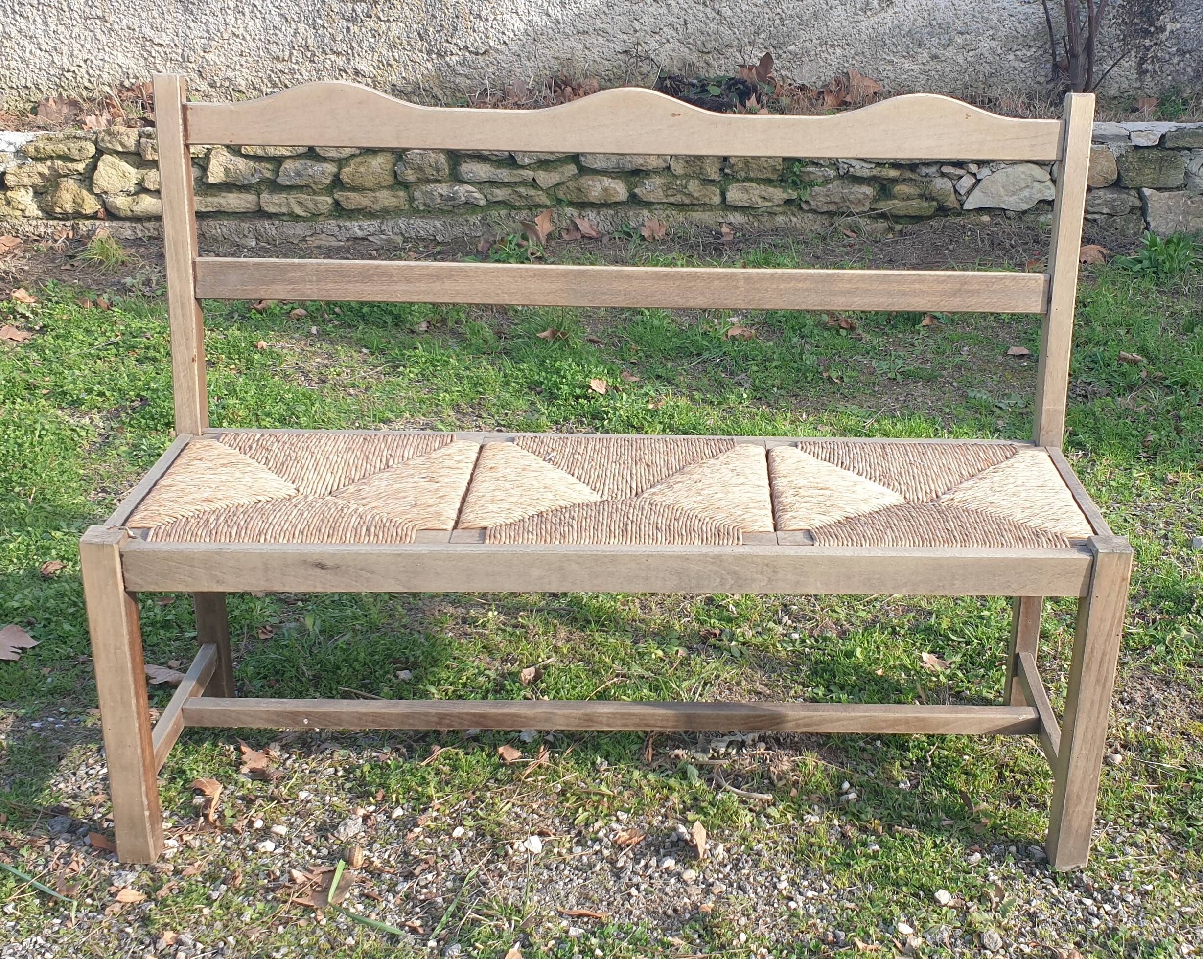 Wooden bench with vintage straw seating