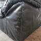Pair of black leather armchairs from the 80s