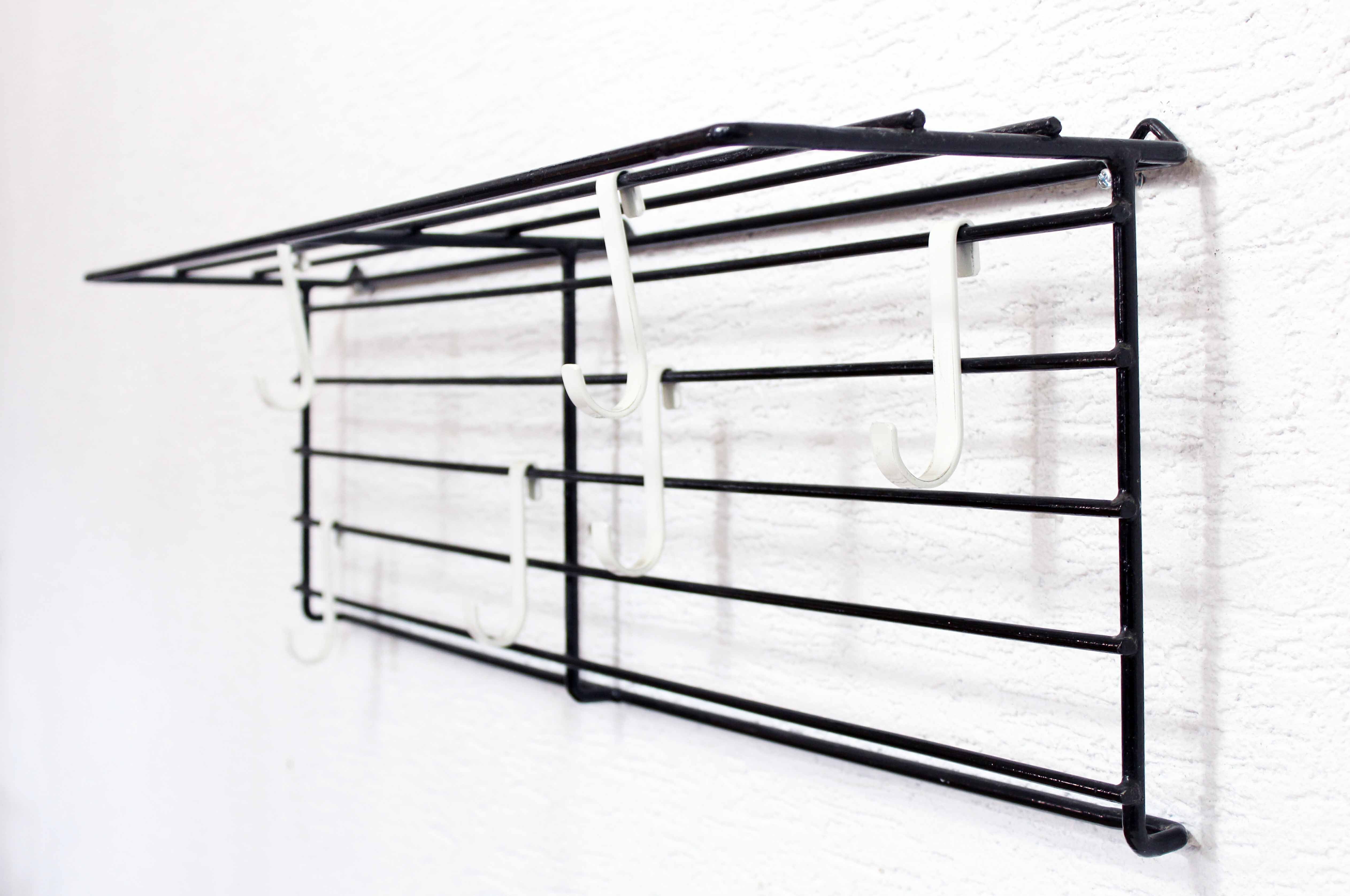 Wall coat rack with removable hooks