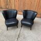 Pair of black cocktail chairs in beech and vinyl, Mid-Century style, 1950s.
