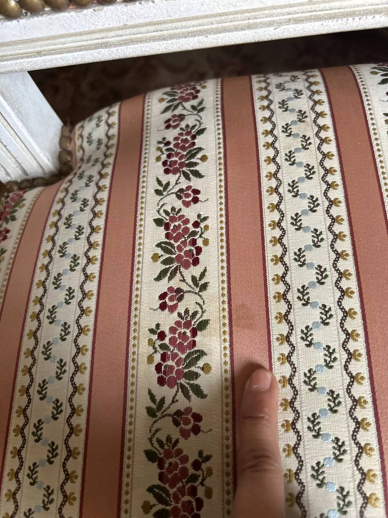 Pair of Louis XVI style chairs in painted wood and satin, classic elegance.