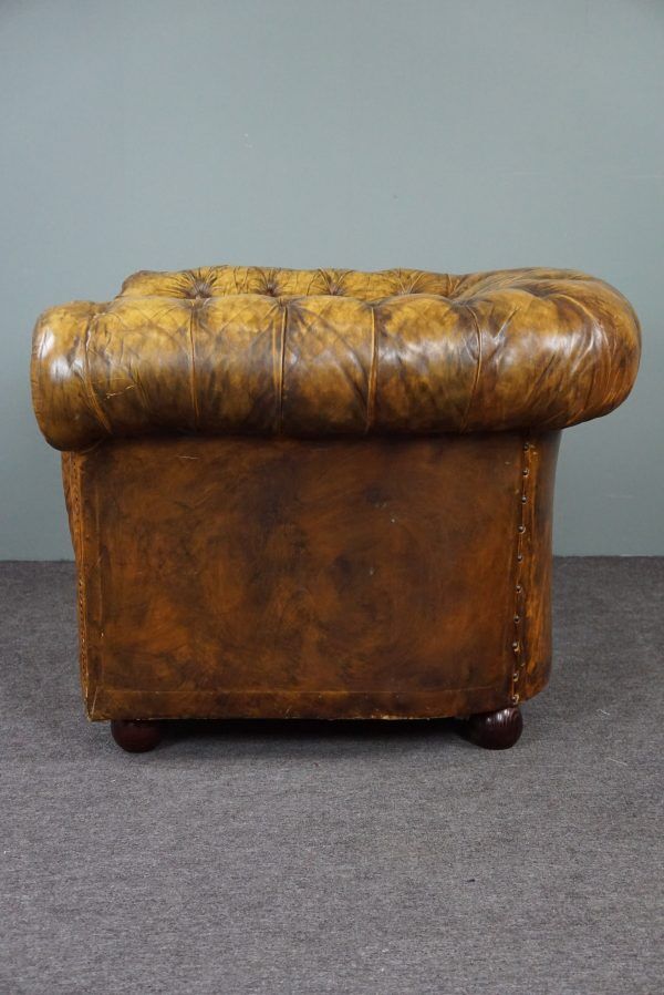 Patinated Chesterfield armchair