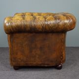 Patinated Chesterfield armchair