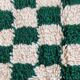 Small Berber rug with green tiles.