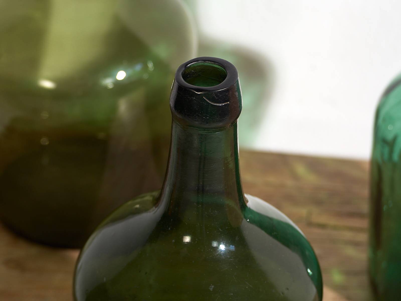 Antique green demijohns (c.1920). Set of 3 pieces