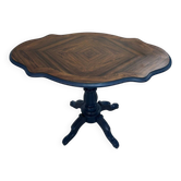 Wooden gueridon with a violin-shaped top in Rio rosewood, central base resting on four legs, reinterpreted in Baltic blue.