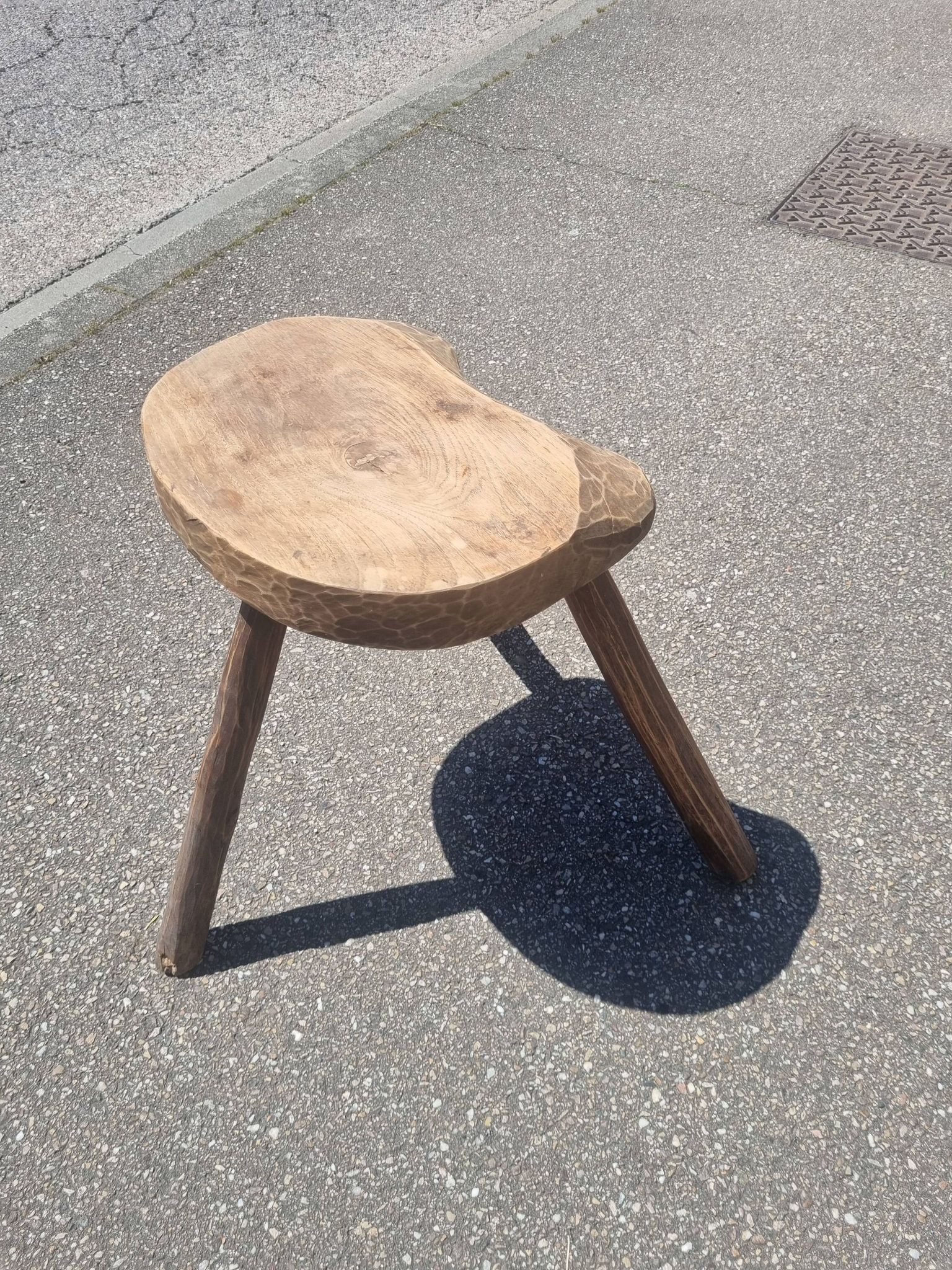 Old wooden tripod stool