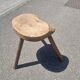 Old wooden tripod stool
