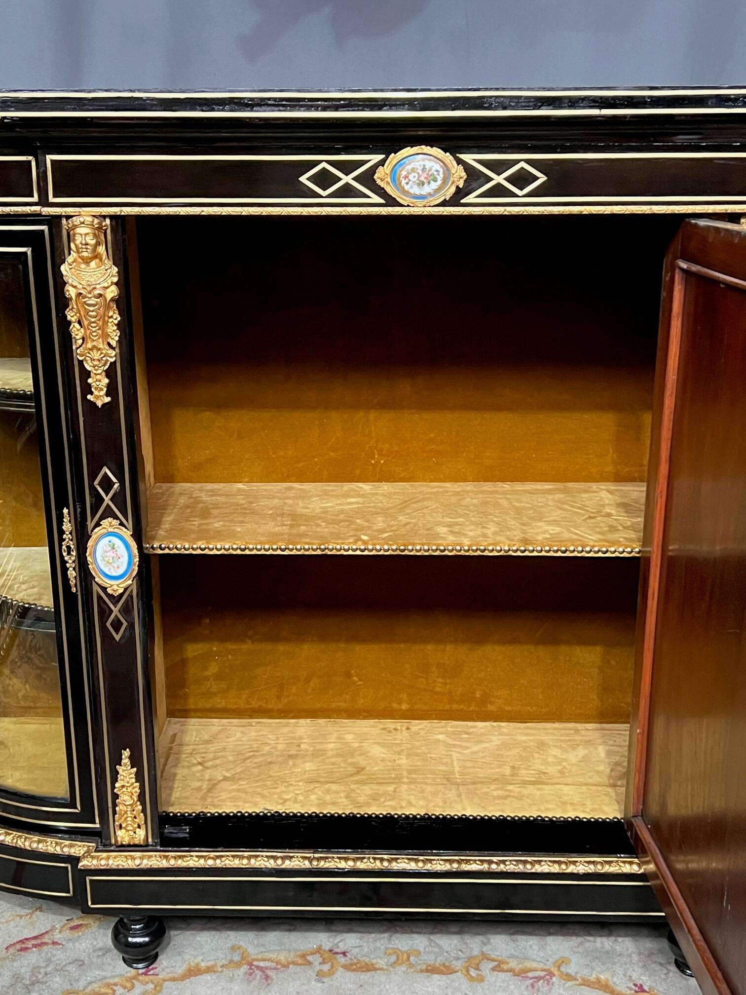 Napoleon III style credenza with four Sèvres medallions.